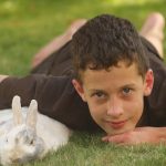 a boy with a pet